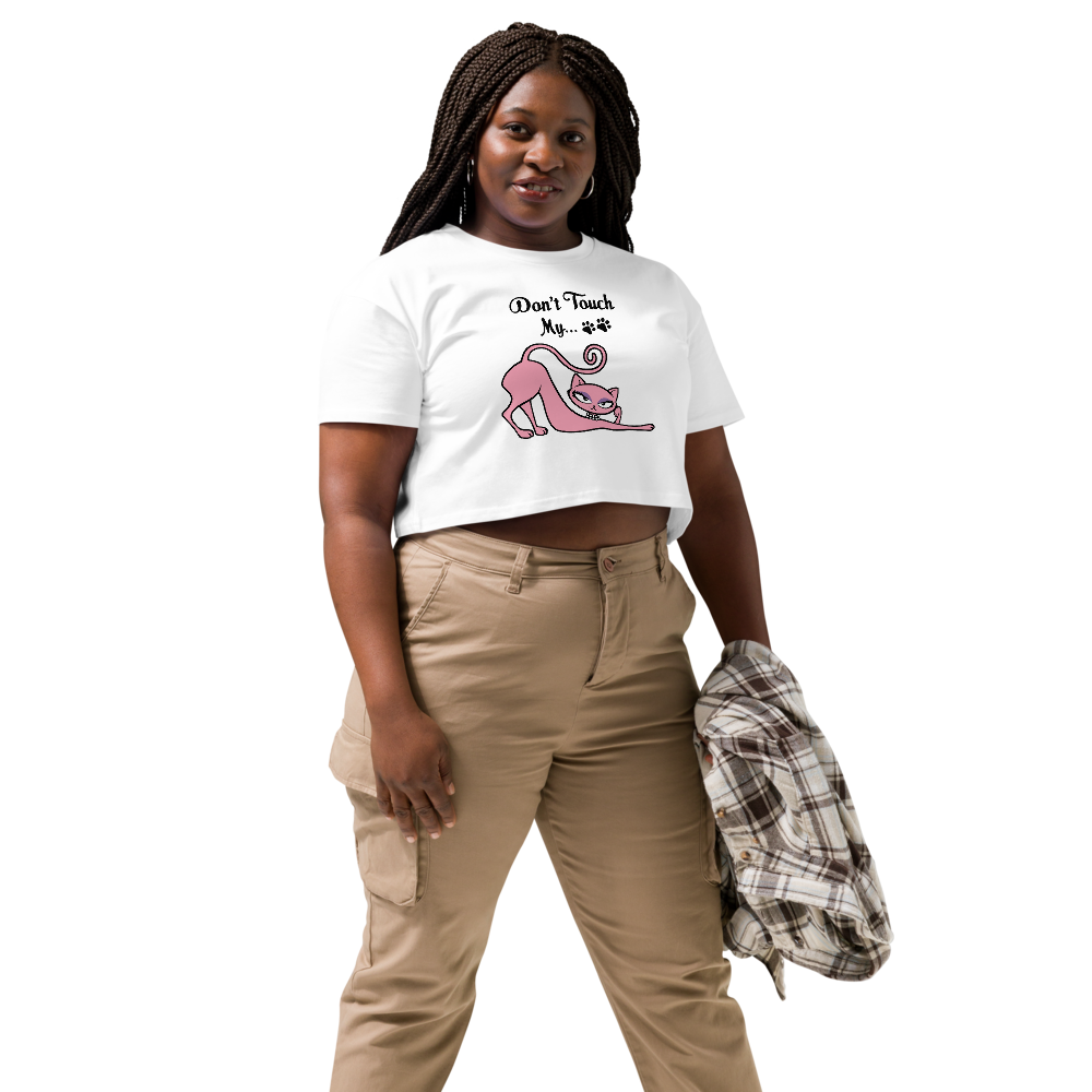 Woman wearing a white Don’t Touch My Kitty crop top with pink cat artwork.