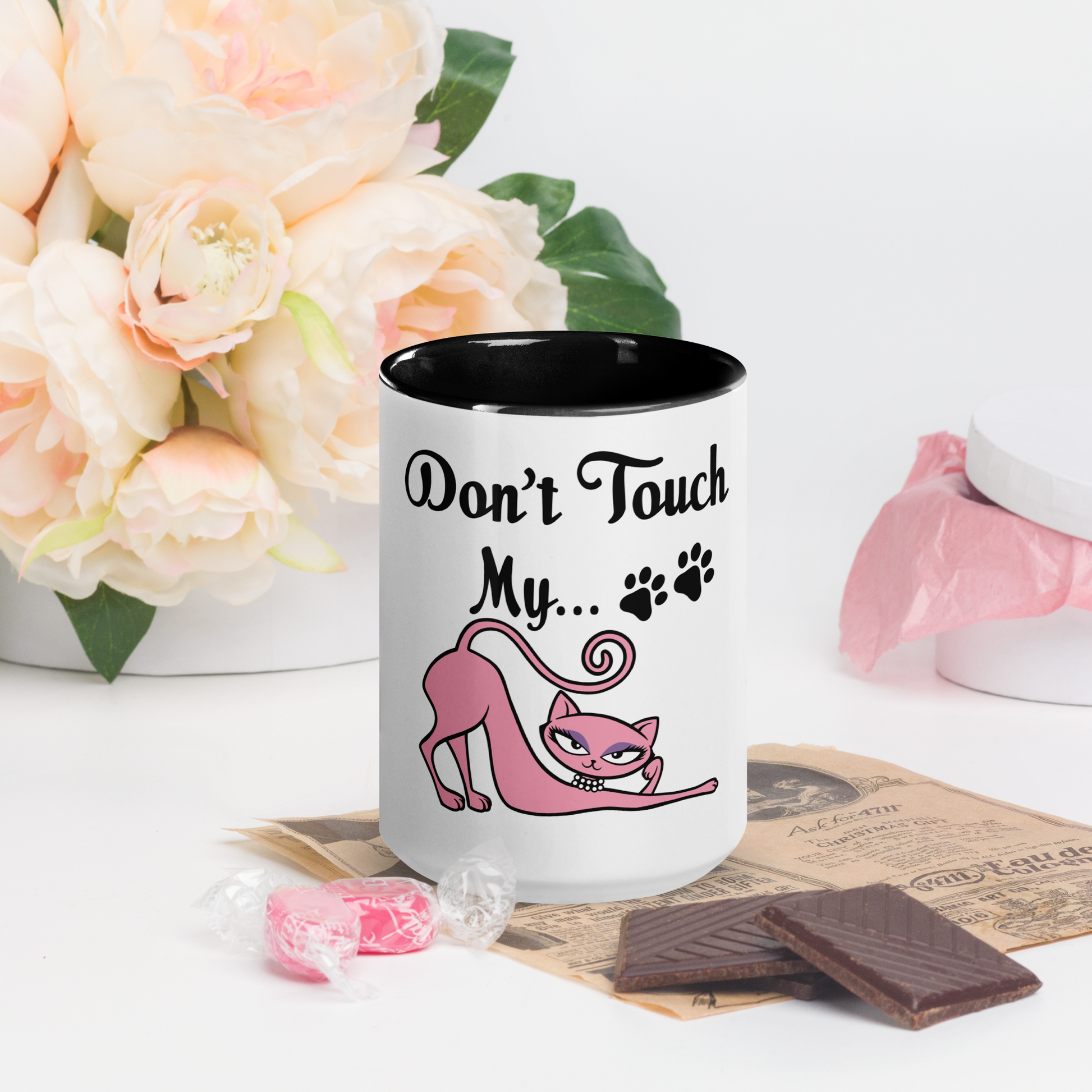 White ceramic mug with black interior featuring the Don't Touch My Kitty pink cat design.