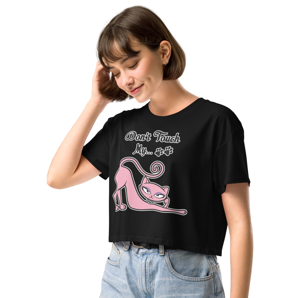 Smiling woman wearing a black Don’t Touch My Kitty crop top with pink cat artwork.