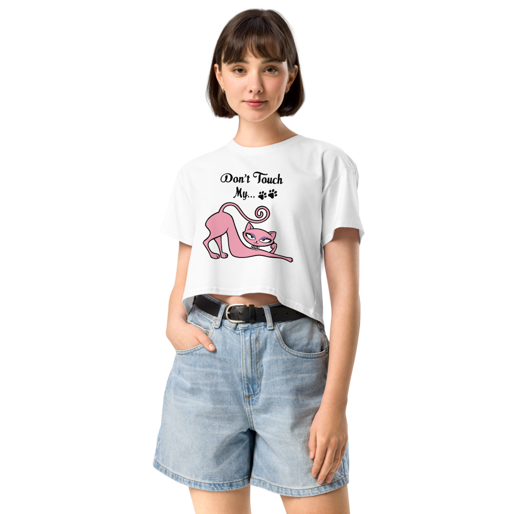 Woman wearing a white Don’t Touch My Kitty crop top with pink cat artwork.