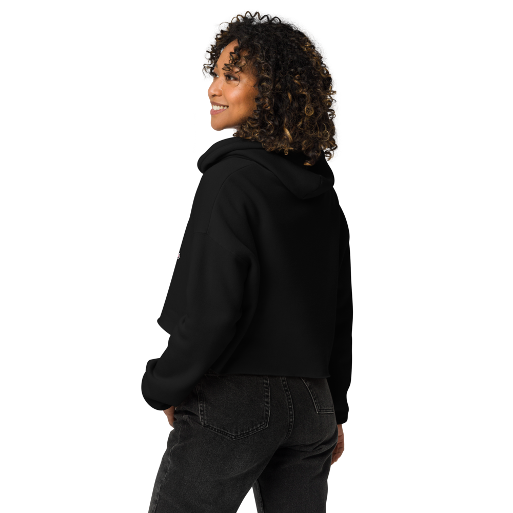 Back view of a model wearing a black cropped Don't Touch My Kitty hoodie.