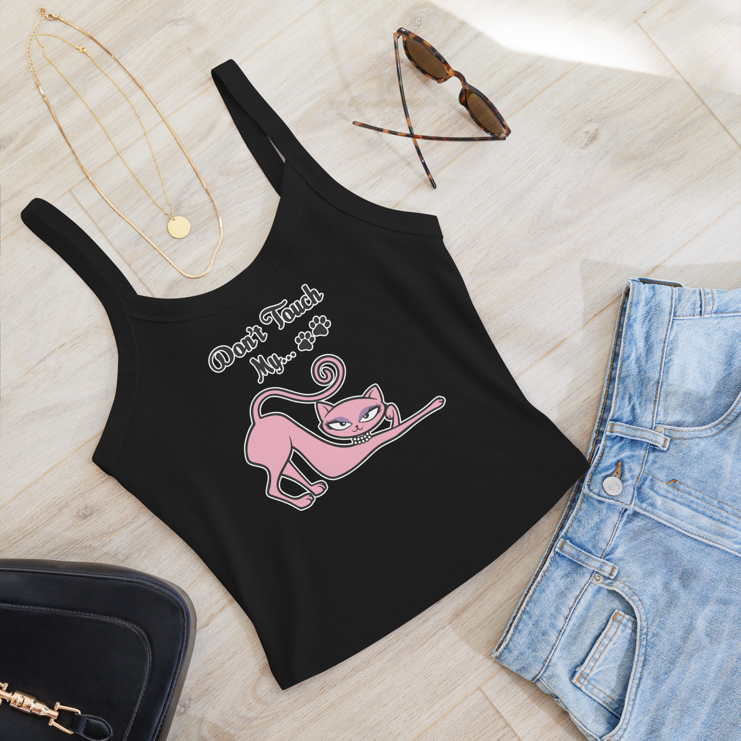 Black micro rib tank top featuring the Don't Touch My Kitty pink cat design styled with denim shorts, sunglasses, and layered necklaces.