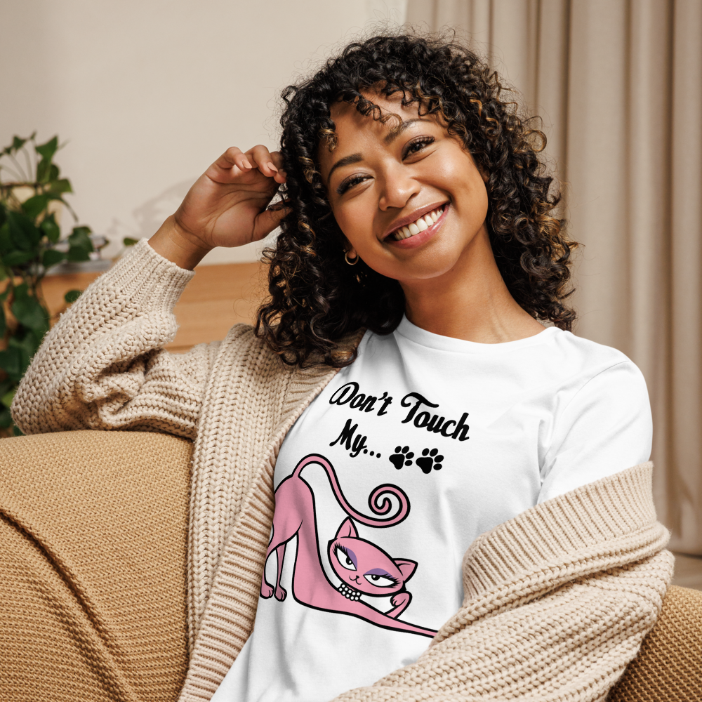 Smiling woman wearing a white Don’t Touch My Kitty tee with pink cat artwork.
